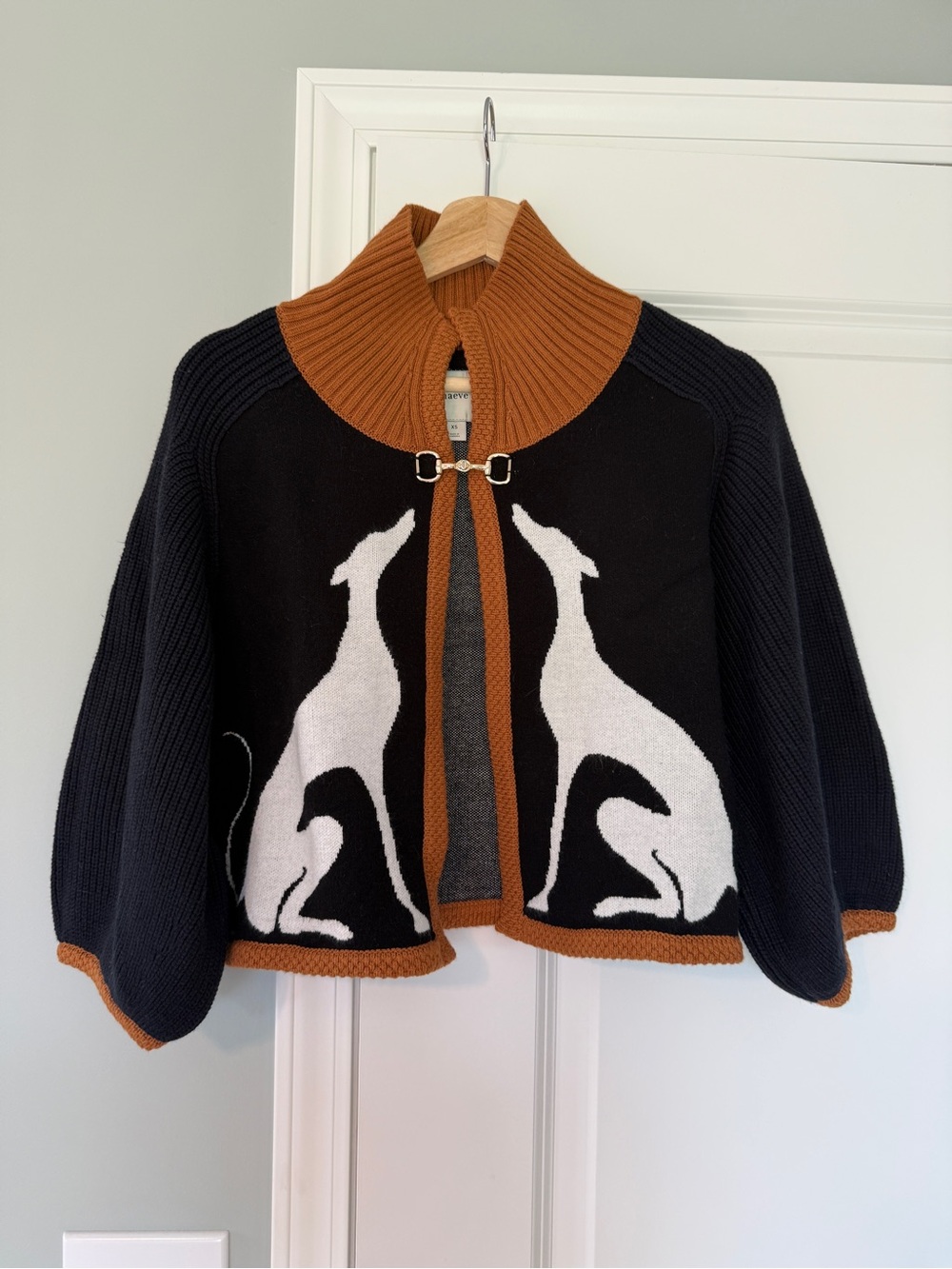 Maeve Black Knit Cape with White Greyhound Motif and Brown Trim